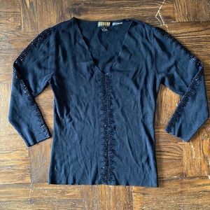 Black fitted quarter sleeve top with open crochet and beaded details